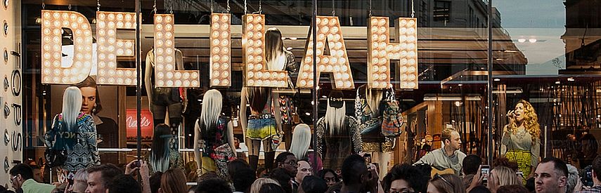 Storefront digital signage display. Live Music Event in TOPSHOP, London.