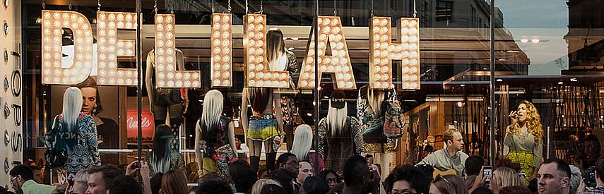 Live Music Event in TOPSHOP, London. Storefront window display becomes a concert venue